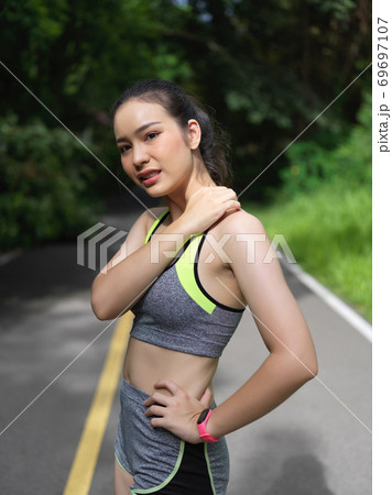 Athlete getting sore muscles after extreme training in the park Athlete getting sore muscles after extreme training in the park 69697107