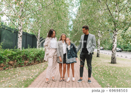 Family with two kids back to school Family with two kids back to school 69698503