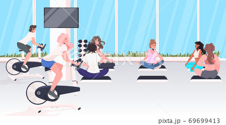 people doing physical exercises cardio training fitness workout healthy lifestyle concept 69699413