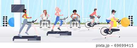 people doing physical exercises on training apparatus fitness workout healthy lifestyle concept 69699415