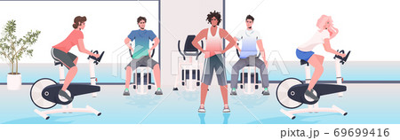 people doing physical exercises on training apparatus fitness workout healthy lifestyle concept 69699416