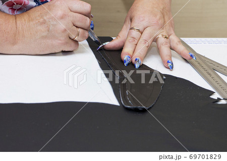 women's tailor hands working with fabric cloth women's tailor hands working with fabric cloth 69701829