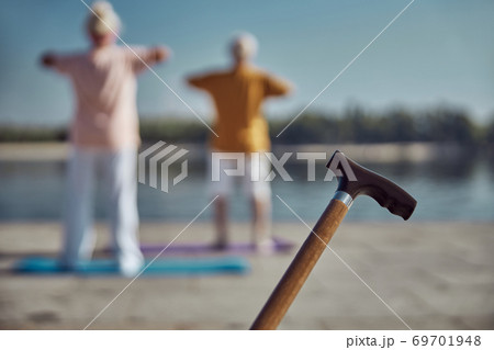 Two elderly people exercising on the quay 69701948