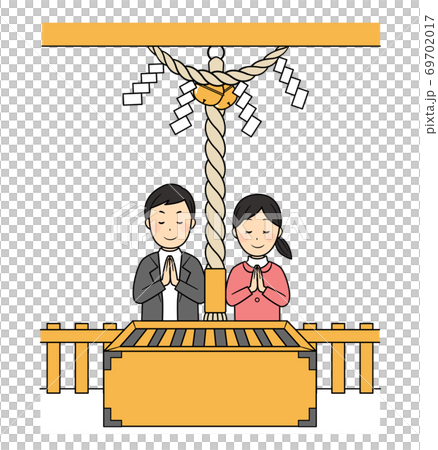 Two people worshiping at a shrine 69702017