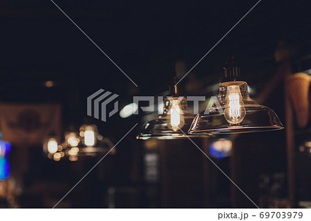 Luxury retro light bulb decor glowing in dark. 69703979