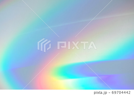 Blurred rainbow light refraction texture on white wall Blurred rainbow light refraction texture on white wall 69704442