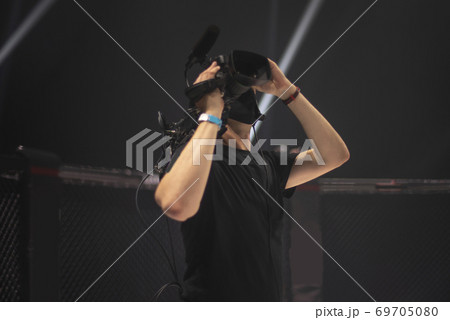 cameraman on the set of the ultimate fighting show. 69705080