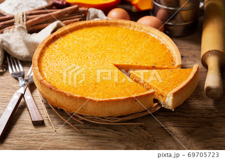 Pumpkin pie with ingredients for cooking 69705723
