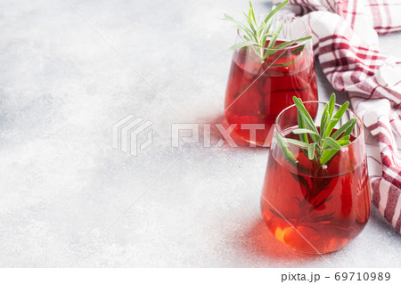 Drink from the berries of red viburnum in glass Cup. Berry compote with vitamin C against the common cold. Copy space. 69710989