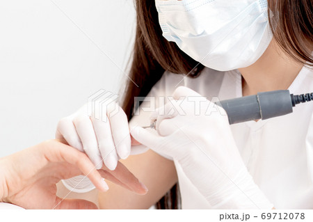 Manicure master making manicure. Manicure master making manicure. 69712078