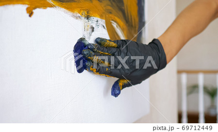 elegant lady hand in black glove runs on white canvas 69712449
