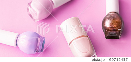 Nail polish bottles on pink background, beauty brand Nail polish bottles on pink background, beauty brand 69712457