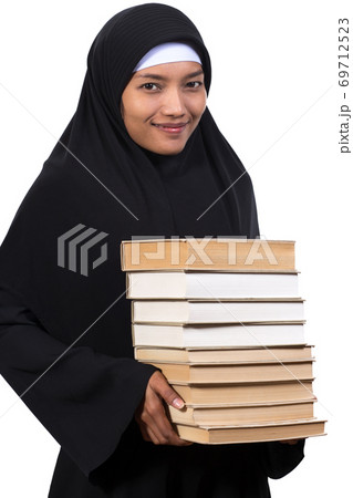 a young woman carries a books 69712523