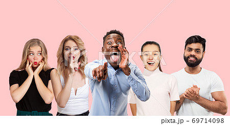 Group portrait of emotional people on coral pink studio background Group portrait of emotional people on coral pink studio background 69714098