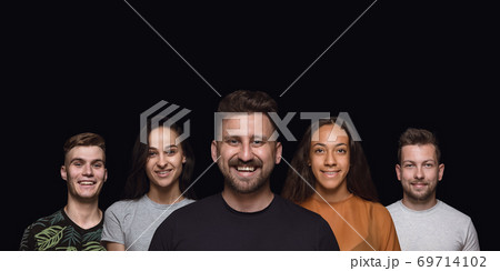 Group portrait of emotional people on black studio background Group portrait of emotional people on black studio background 69714102