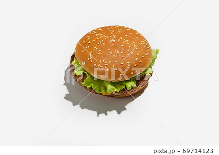 Delicious and quick lunch with fast food or home delivery for client during coronavirus pandemic. Yummy hamburger with lettuce 69714123