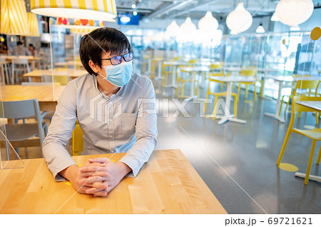 Sitting with shield partition for social distancing Sitting with shield partition for social distancing 69721621