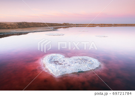 Heart from salt in pink water salt lake 69721784