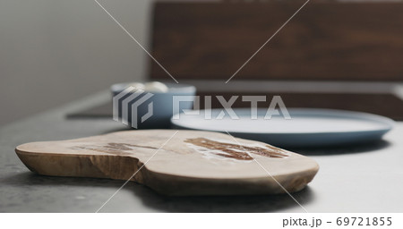empty olive wood board on kitchen countertop 69721855