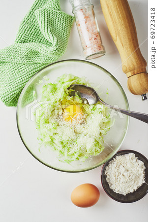 Ingredients for cooking zucchini pancakes Ingredients for cooking zucchini pancakes 69723418
