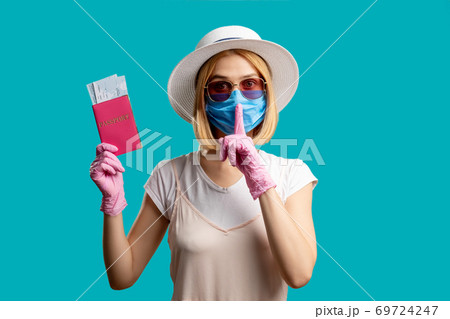 silence gesture travel restriction woman mask 69724247