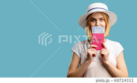 holiday trip travel agency happy woman passport 69724311
