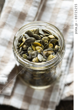 Peeled pumpkin seeds. Peeled pumpkin seeds. 69725255