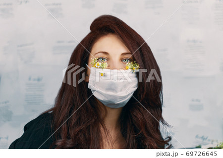 Young attractive woman in floral face mask 69726645