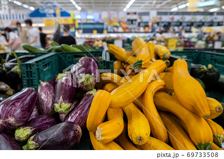 Close up Organic Long Purple Aubergine or Eggplant Solanum melongena and squash Close up Organic Long Purple Aubergine or Eggplant Solanum melongena and squash 69733508