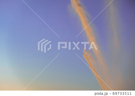 irrigation of a field against sky at sunset 69733511