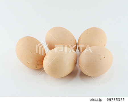 5 fresh chicken eggs dirty from chicken manure on white background 69735375