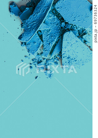 Blue eye shadow powder as makeup palette closeup, crushed cosmetics and beauty texture Blue eye shadow powder as makeup palette closeup, crushed cosmetics and beauty texture 69736324