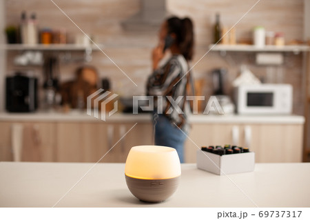 Having a conversation unsing smartphone 69737317