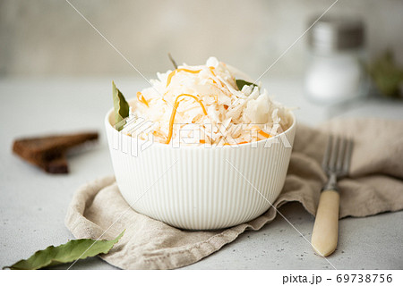 homemade sauerkraut with carrots and bay leaves homemade sauerkraut with carrots and bay leaves 69738756