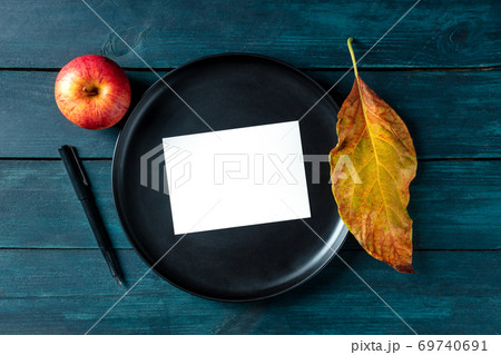 Autumn stationery mockup, a blank greeting card or invitation, shot from above on a tray with a place for text Autumn stationery mockup, a blank greeting card or invitation, shot from above on a tray with a place for text 69740691