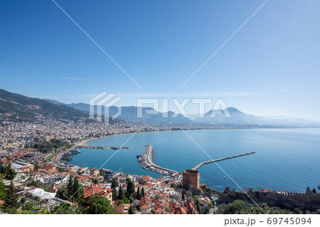 An aerial view of the bay Alanya in Antalya Turkey. Sea and city with an open sky. An aerial view of the bay Alanya in Antalya Turkey. Sea and city with an open sky. 69745094
