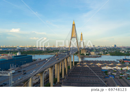 Aerial view of Bhumibol Bridge and Chao Phraya River in structure of suspension architecture concept, Urban city, Bangkok. Downtown area at sunset, Thailand. Aerial view of Bhumibol Bridge and Chao Phraya River in structure of suspension architecture concept, Urban city, Bangkok. Downtown area at sunset, Thailand. 69748123