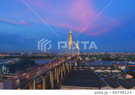 Aerial view of Bhumibol Bridge and Chao Phraya River in structure of suspension architecture concept, Urban city, Bangkok. Downtown area at night, Thailand. Aerial view of Bhumibol Bridge and Chao Phraya River in structure of suspension architecture concept, Urban city, Bangkok. Downtown area at night, Thailand. 69748124