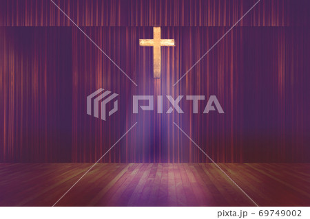 wooden cross on red curtain background in small church 69749002
