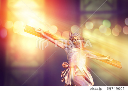 jesus on cross in church with ray of light from stained glass, easter festival Christian Church 69749005