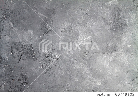 Concrete dark gray background with scuffs and black splashes. Textured wall texture in the grunge style. 69749305