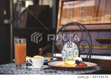 Beautiful healthy breakfast in a restaurant for two next to the piano 69749476