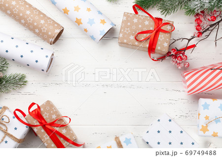 Christmas gift boxes packaging, paper rools, decor and fir tree 69749488