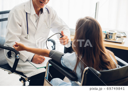 Rear View Of Woman Sitting At Doctor Office 69749841