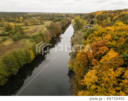 Aerial view of river Snov in autumn near village of Sednev, Ukraine. Aerial view of river Snov in autumn near village of Sednev, Ukraine. 69750402