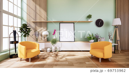 Cabinet wooden and yellow arm chair in Living green light wall interior japanese style. 3d rendering 69753962