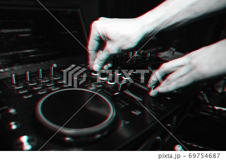 hands of DJ controllers for music on professional mixer for mixing music 69754687