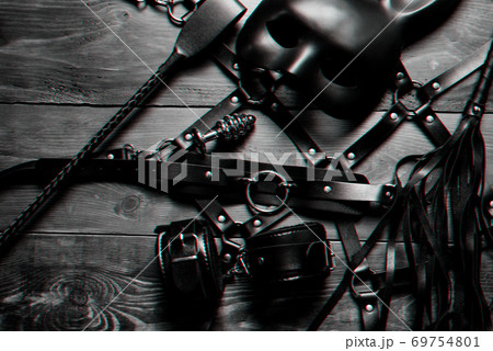 set of sex toys for hard BDSM sex with domination and submission. Leather whip, handcuffs, belt 69754801