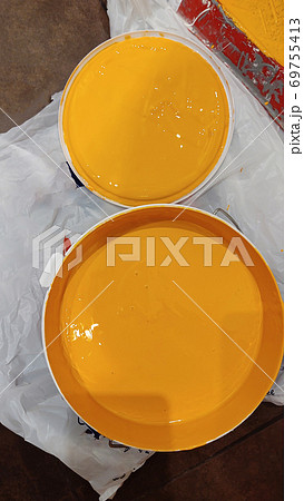 Paint can with orange paint Paint can with orange paint 69755413