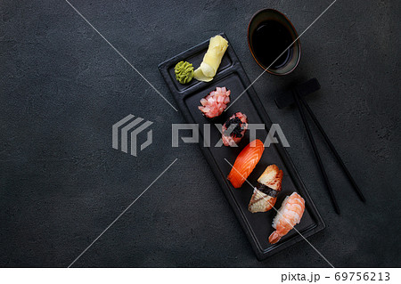 Nigiri sushi set on black stone texture background 69756213